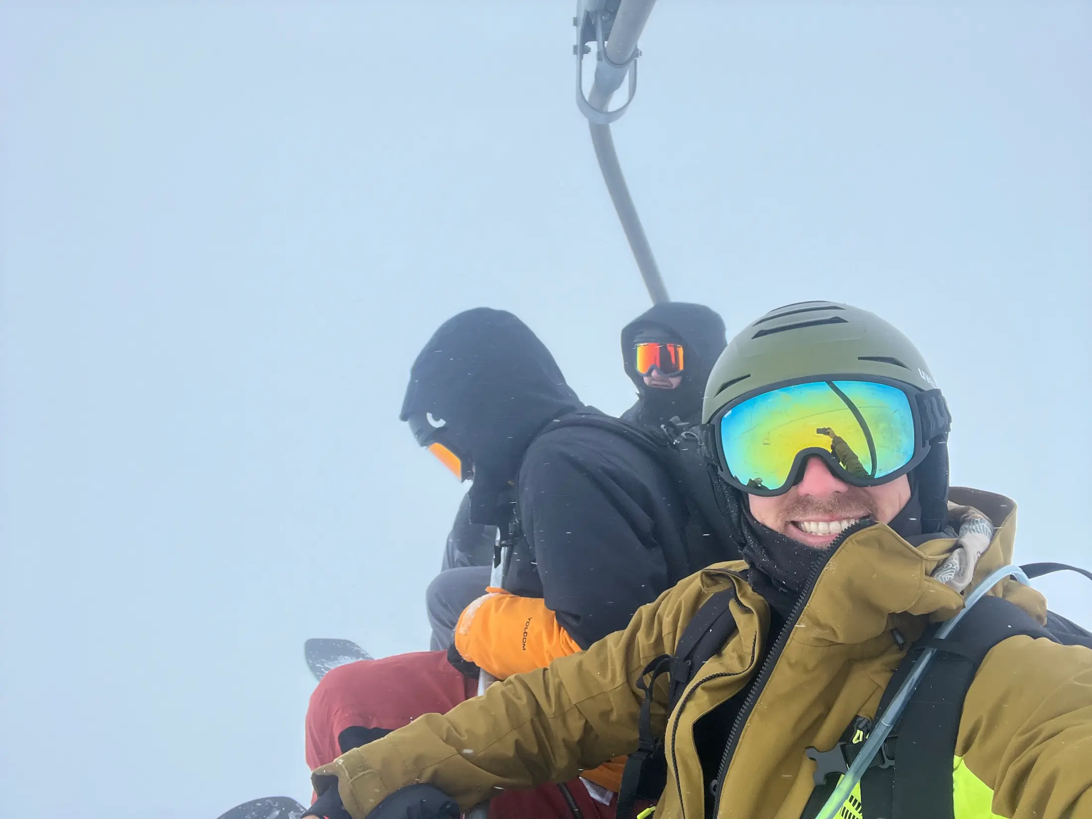 me with two of my snowboarding buddies on a shairlift with absolutely zero visibility on the slopes of Austrian Alps